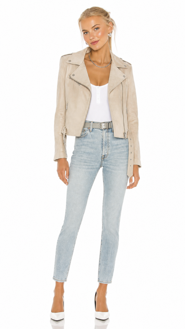 Beige faux suede moto jacket for women with silver zipper details, notched lapels, long sleeves, and cropped fitted silhouette.