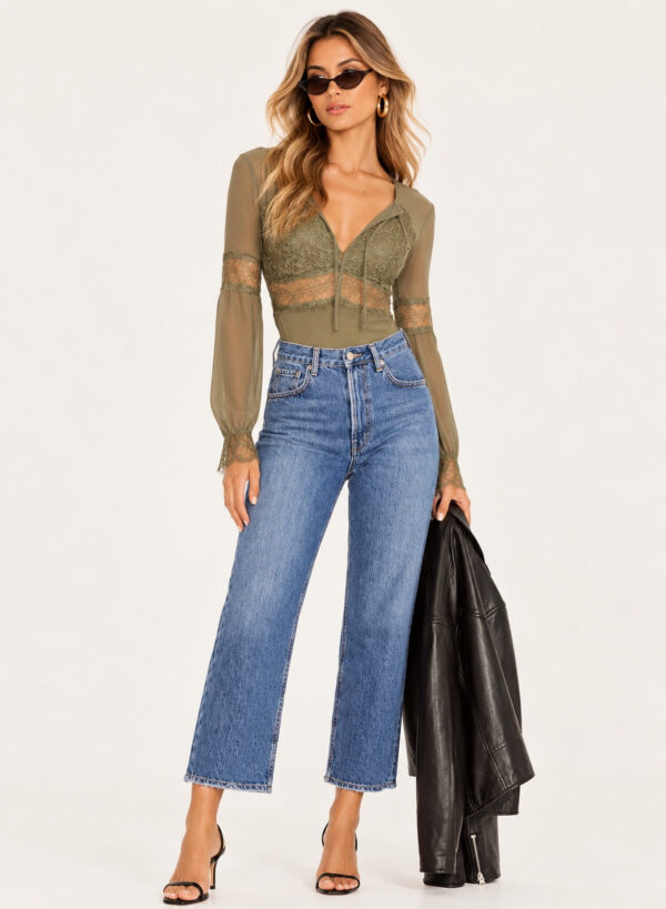 Model wearing olive green long sleeve lace bodysuit with sheer waist panels, floral lace details and high-waisted wide-leg jeans.
