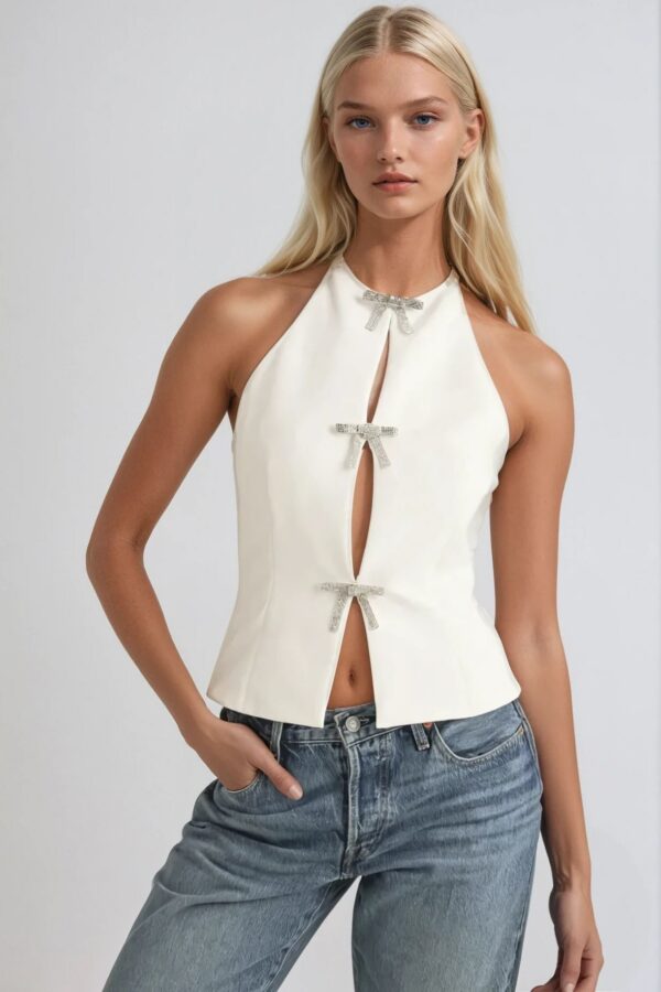 Bridal white rhinestone bow halter top styled with light wash denim jeans