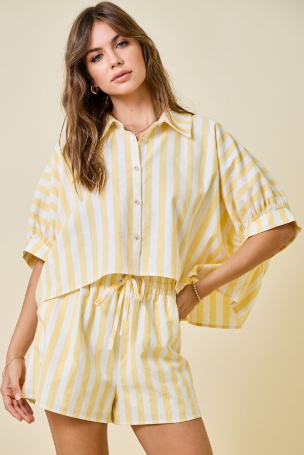 Woman wearing butter yellow striped oversized cropped shirt with matching shorts set