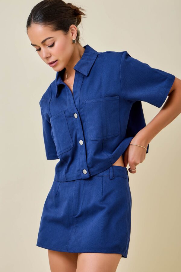 Cropped button-down denim-inspired top with matching mini skirt for women