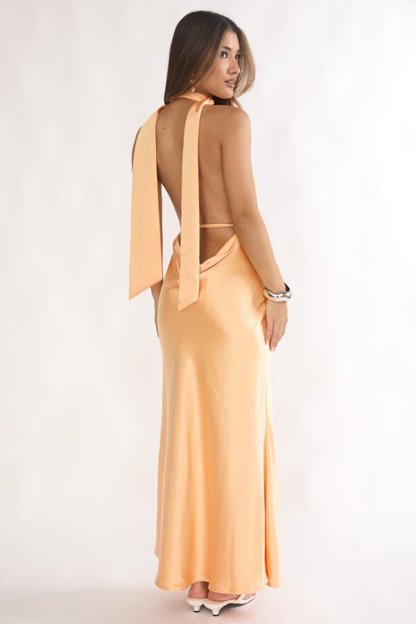 Elegant peach satin wedding guest maxi dress for summer events.