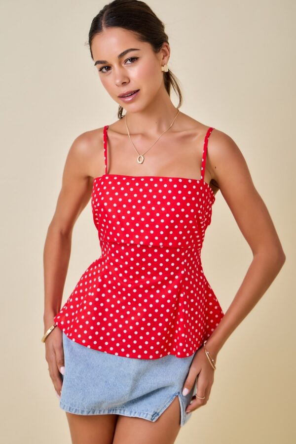 Red polka dot peplum cami top for women with layered bust panel and adjustable spaghetti straps front view