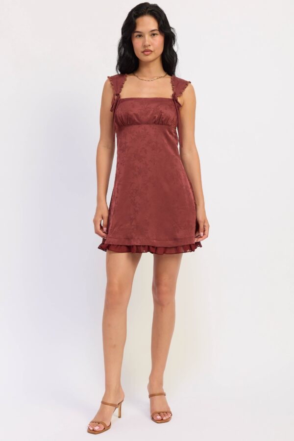 Model wearing maroon satin jacquard mini dress; a satin jacquard finish and a mini-length silhouette