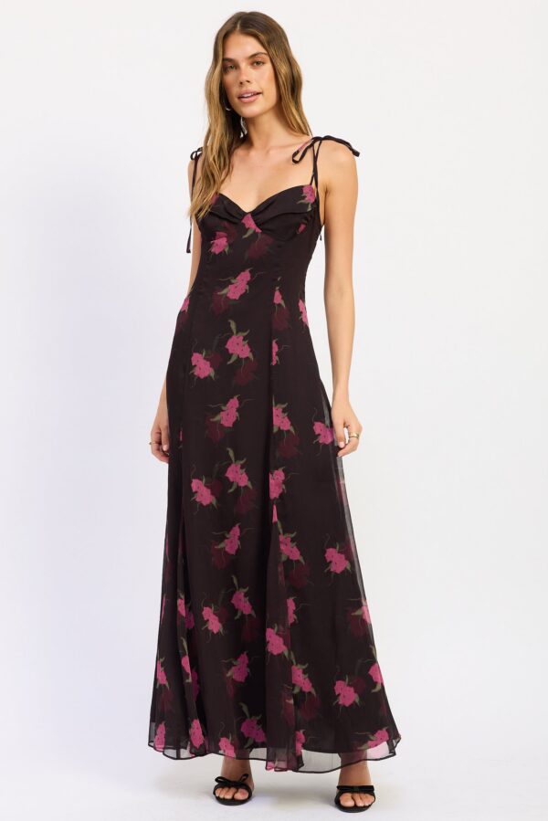 Model wearing black and pink floral tie shoulder midi dress