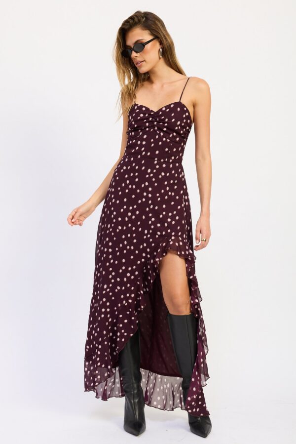 Styled view of wine polka dot ruffle slit maxi dress