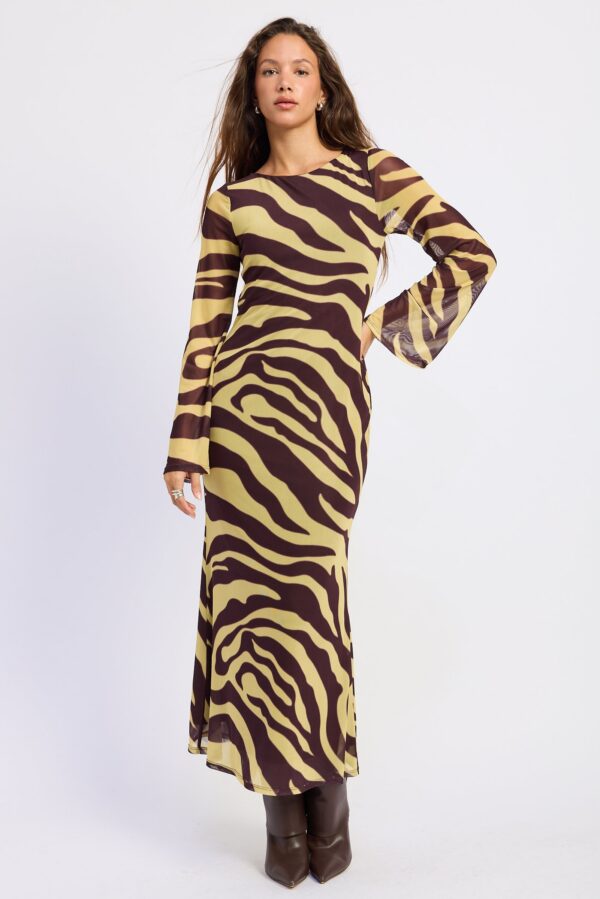 Model wearing brown yellow zebra open back maxi dress